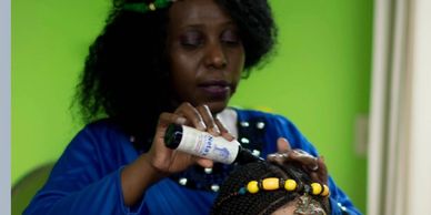 Martha, a licensed cosmetologist with over 15 years of experience running a hair braiding salon,