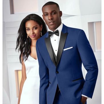 Blue formalwear and a black bowtie with a white tuxedo shirt