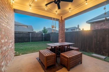 Medium term rental backyard patio with furniture for relaxing nights