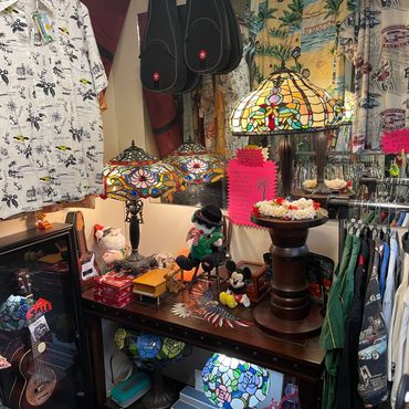 Ukuleles paired with Hawaiian shirts for sale in Daytona store