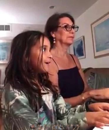 A woman teach the piano with Girl