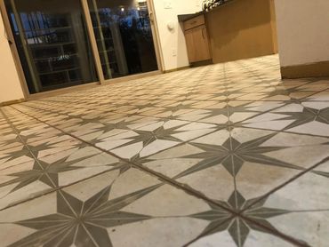 Kitchen floor with decorative 18 x 18 tiles with 1/16th grout joints