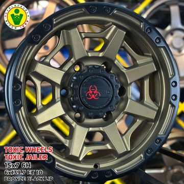 Bronze black lip Toxic Jailer wheel with biohazard logo.