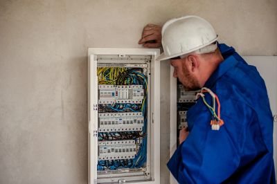 an electrician checking the wires