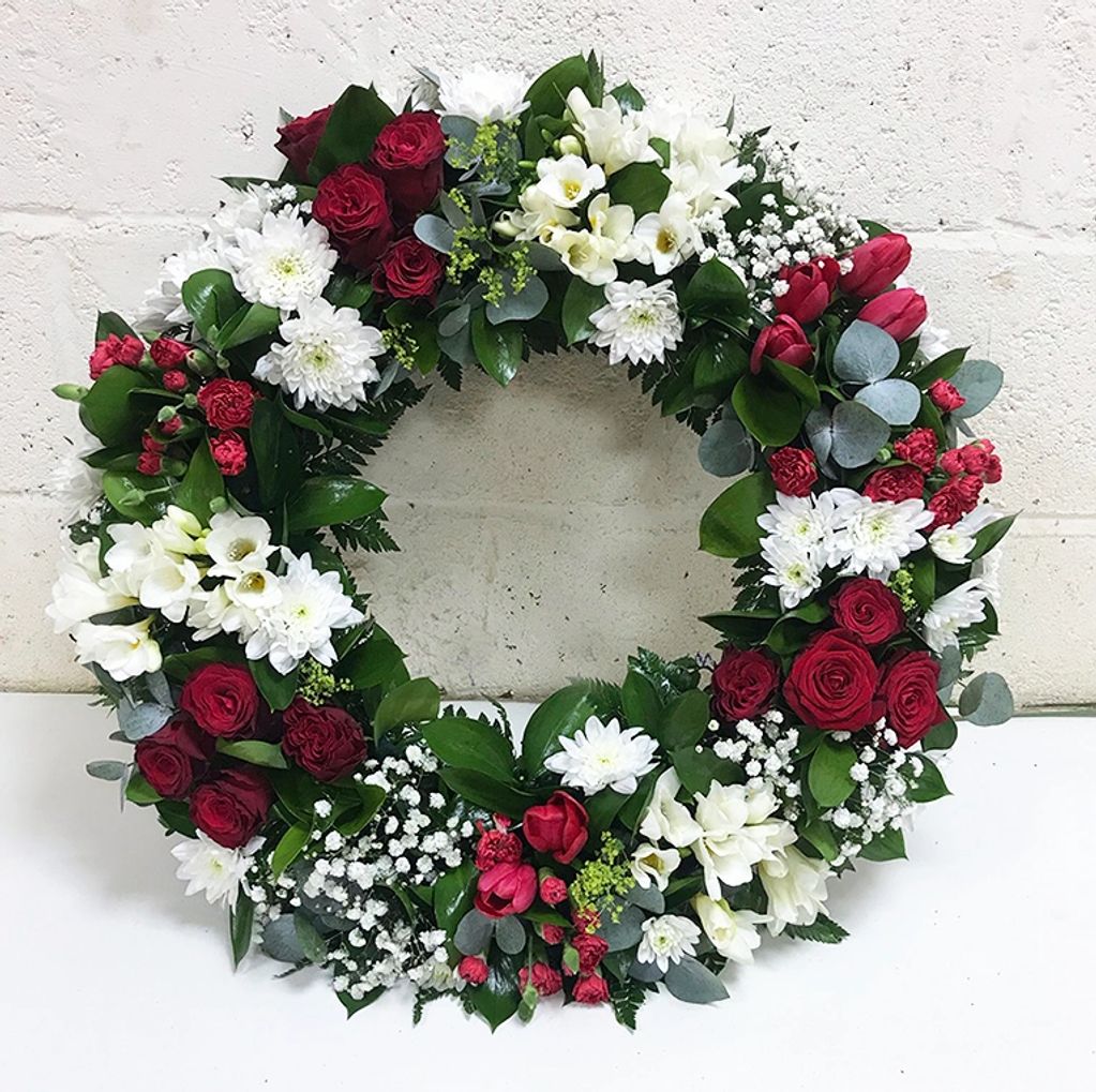 A stunning wreath, lovingly created with a variety of flowers