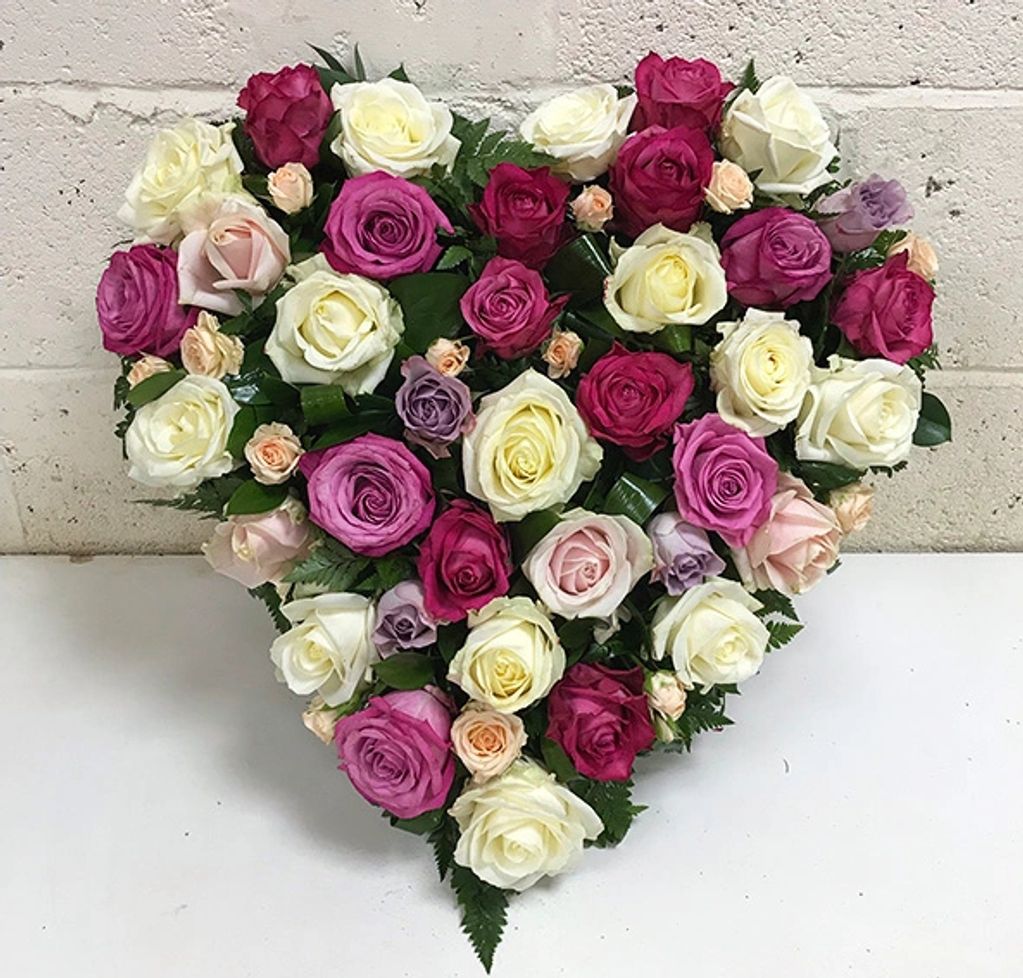 A wonderful heart adorned with luxury roses of various shades