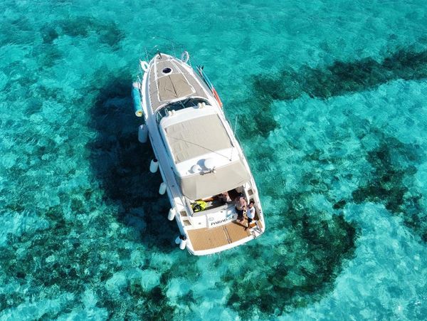 Aerial view of the beautiful Yacht on the crystal blue waters of Isla Mujeres and Cancun