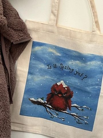 Is It Spring Yet? Photo of a canvas tote bag featuring a WhimzyWorks original painting of a grumpy b
