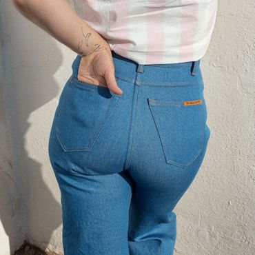 Close up on model's butt in High Pope jeans in western blue