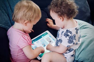 Babies looking at tablet device