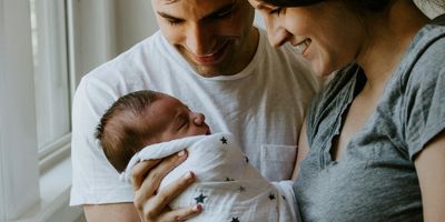 Parents holding newborn