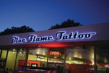 Illuminated channel letter sign on building