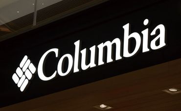 Illuminated channel letter sign on building