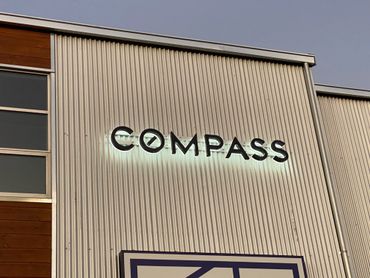 Illuminated channel letter sign on building