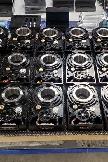 volume production of motion control pan tilt rotator systems for camera control