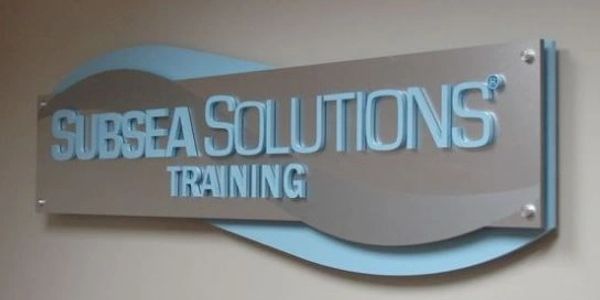 layered reception sign, with painted acrylic lettering and brushed aluminum.