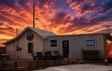 Mystery Shack Cigars & Coffee storefront in Shallowater, Texas at sunset.