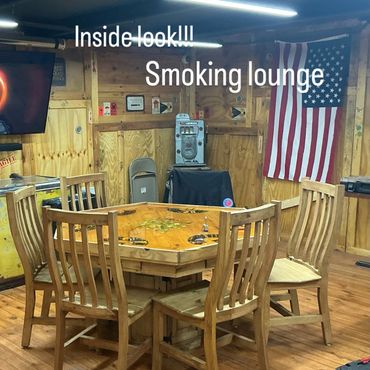 Poker table and seating inside the smoking lounge at Mystery Shack Cigars & Coffee in Shallowater, T
