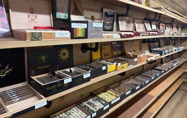 Walk-in humidor filled with premium cigars at Mystery Shack Cigars & Coffee in Shallowater, Texas.