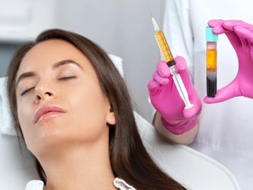 Woman receiving a cosmetic injection treatment with serum.