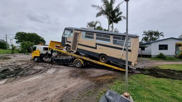 small trucks and bus towing