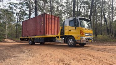 Shipping container transport tilt tray