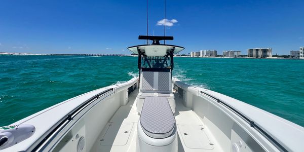 Our 36' Yellowfin gracefully cutting through the Emerald Waters of the Destin Jetties.