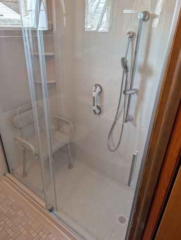Tub to walk in shower conversion, Moen switchable shower handle, with glass shower door.
