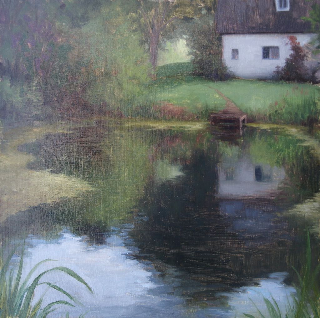 Reflective pond next to house