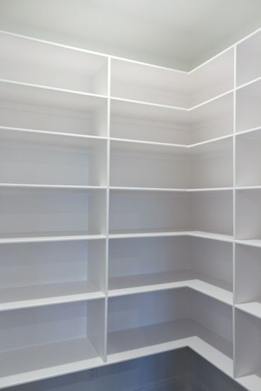 A white pantry shelf from top to bottom