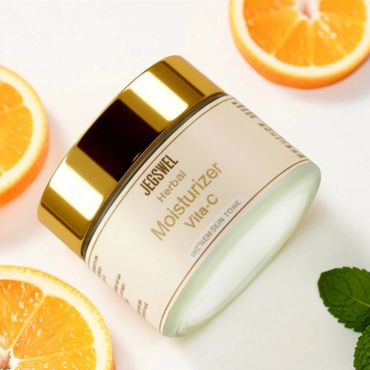 Jar of JEGSWEL Vitamin C moisturizer with orange slices and mint leaves.
