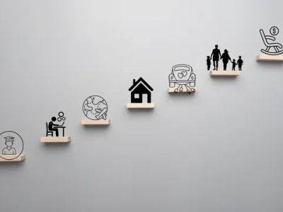 Wooden icons on shelves representing life stages from education to retirement.