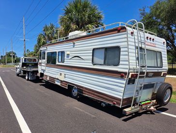 tow truck towing a motorhome