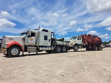 tow truck towing a semitruck