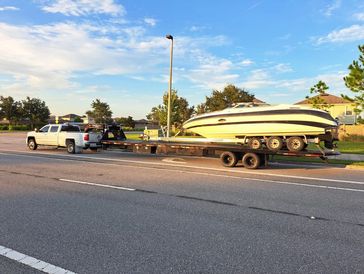 landoll truck towing a boat