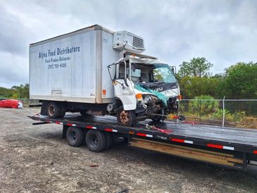 landoll truck towing a box truck