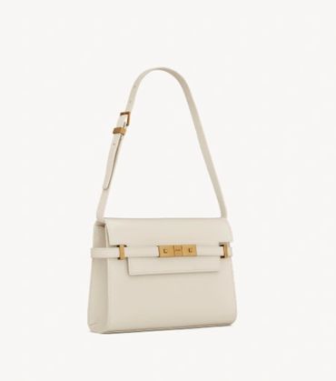 Louis Vuitton OnTheGo tote placed upright in closet.