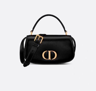 Dior Lady Dior in dust bag with protected handles.