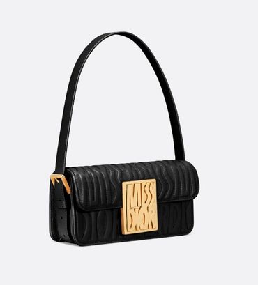 Dior Saddle bag in dust bag with charms protected.