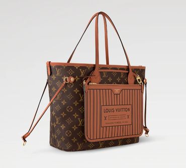 Louis Vuitton Keepall travel bag in protective cover.