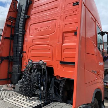 back of red / orange volvo truck