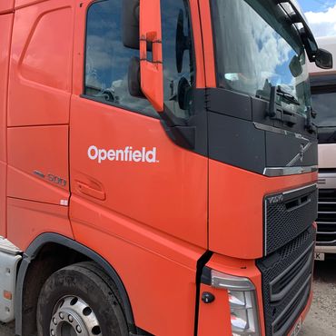 side view of one of our orange red trucks