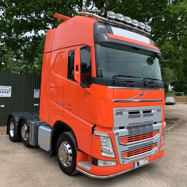 centre transport sales orange volvo truck