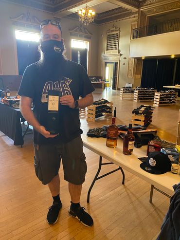 Raffle winner with The Macallan prize