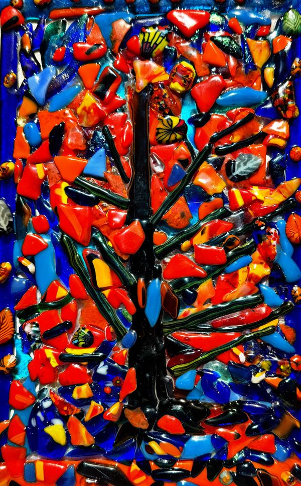 Vibrant mosaic art depicting a tree with colorful leaves against a blue background.