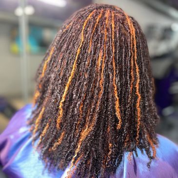 Sammie Locs Installation Client wanted to add some spice to her locs, so we colored her locs.
