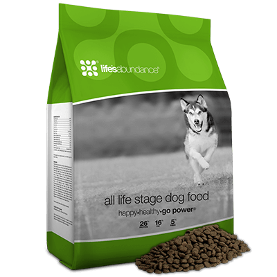 Bag of Life's Abundance dog food with kibble spilled out.