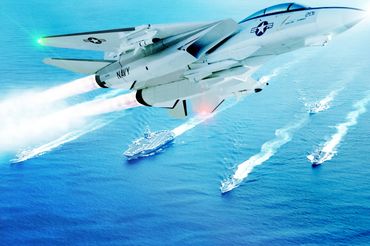 Multiple layer composite of an F-14 flying over an Aircraft Carrier