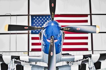 A p-51 Mustang and the American Flag