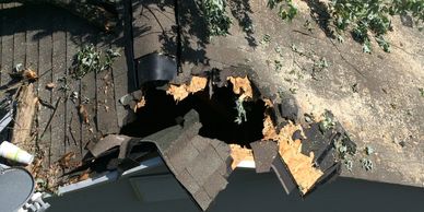 Whole in roof of house after storm in richmond Va